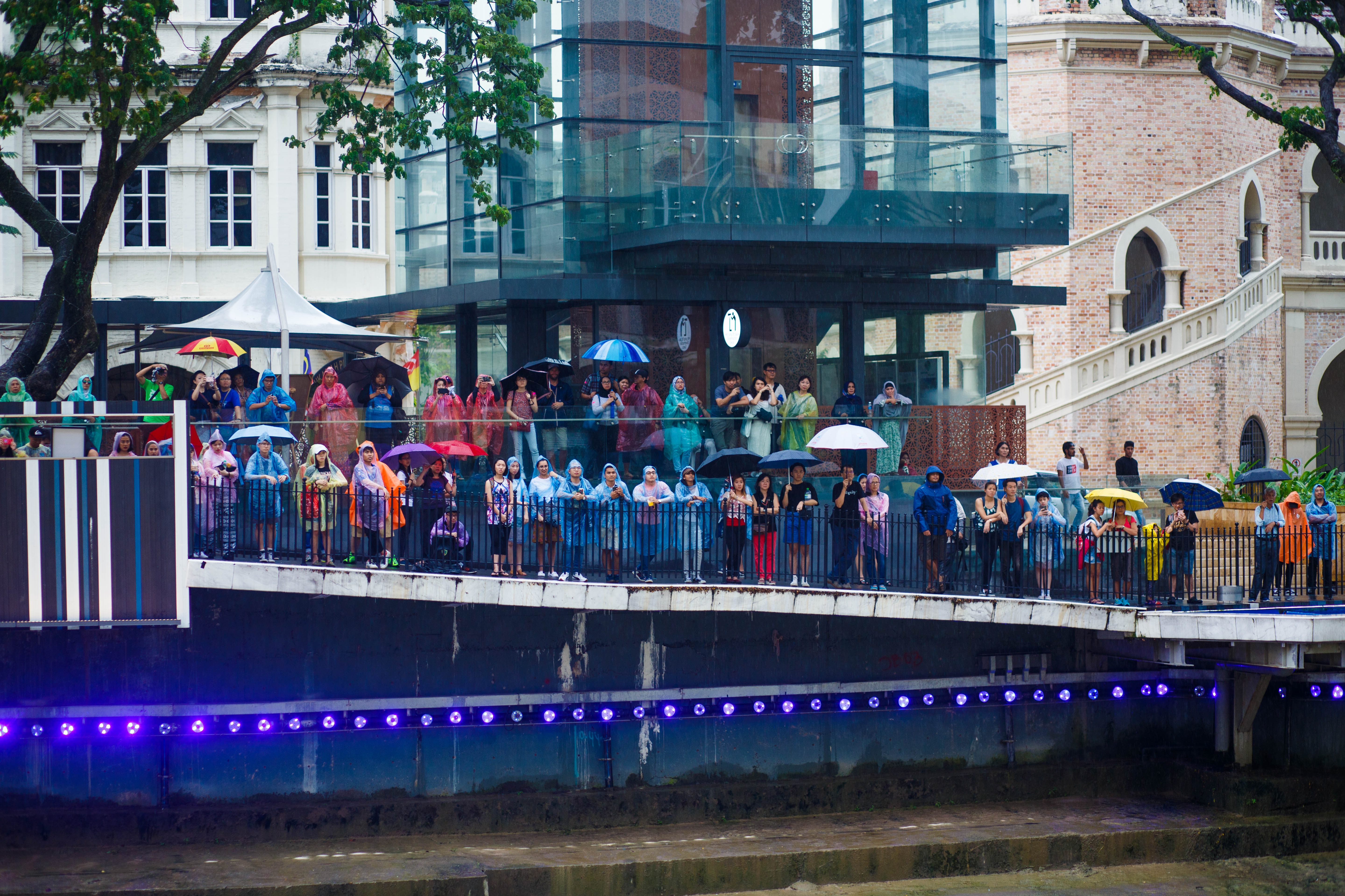 Audience watching in the rain
