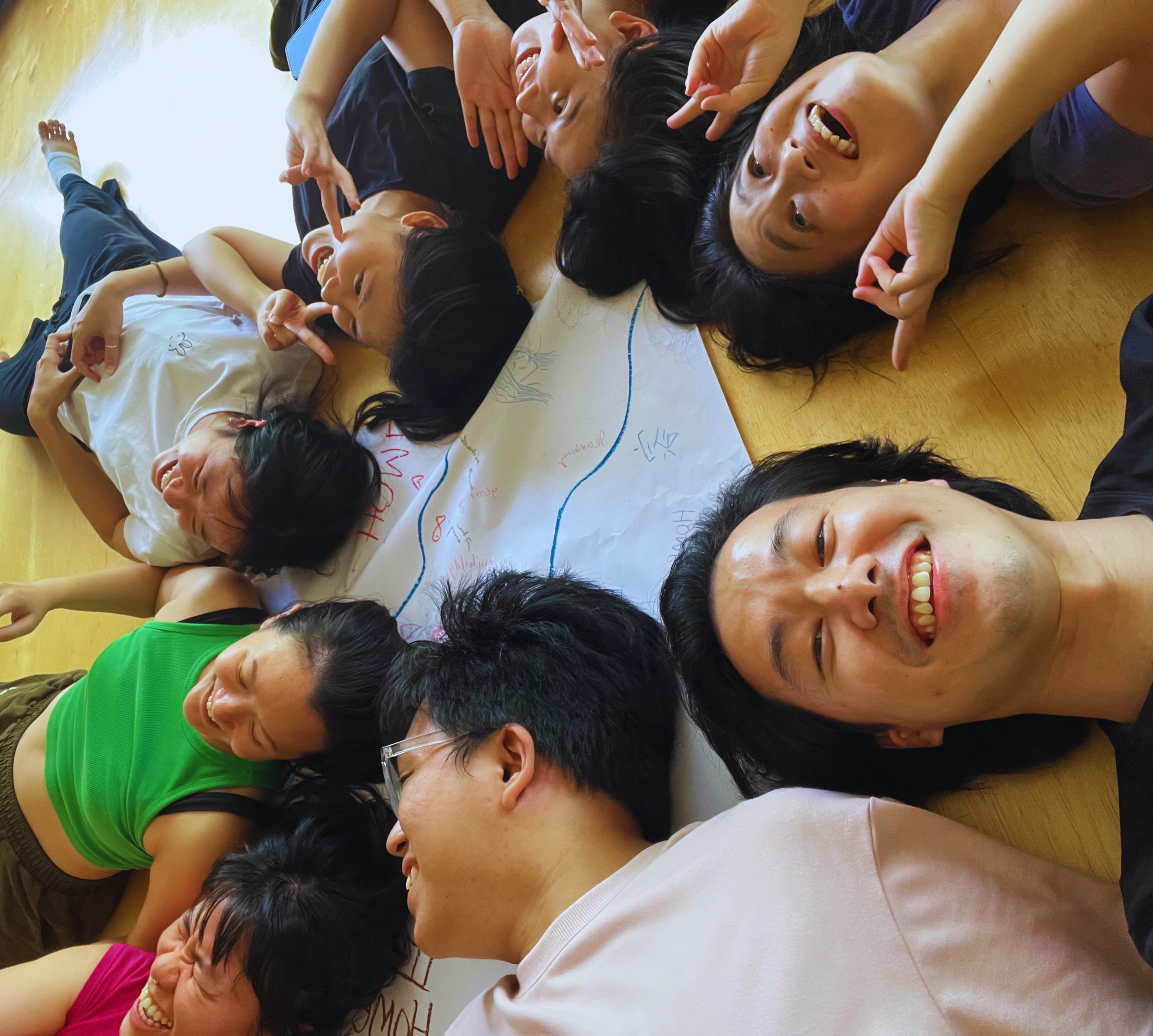 Participants lying together in a circle